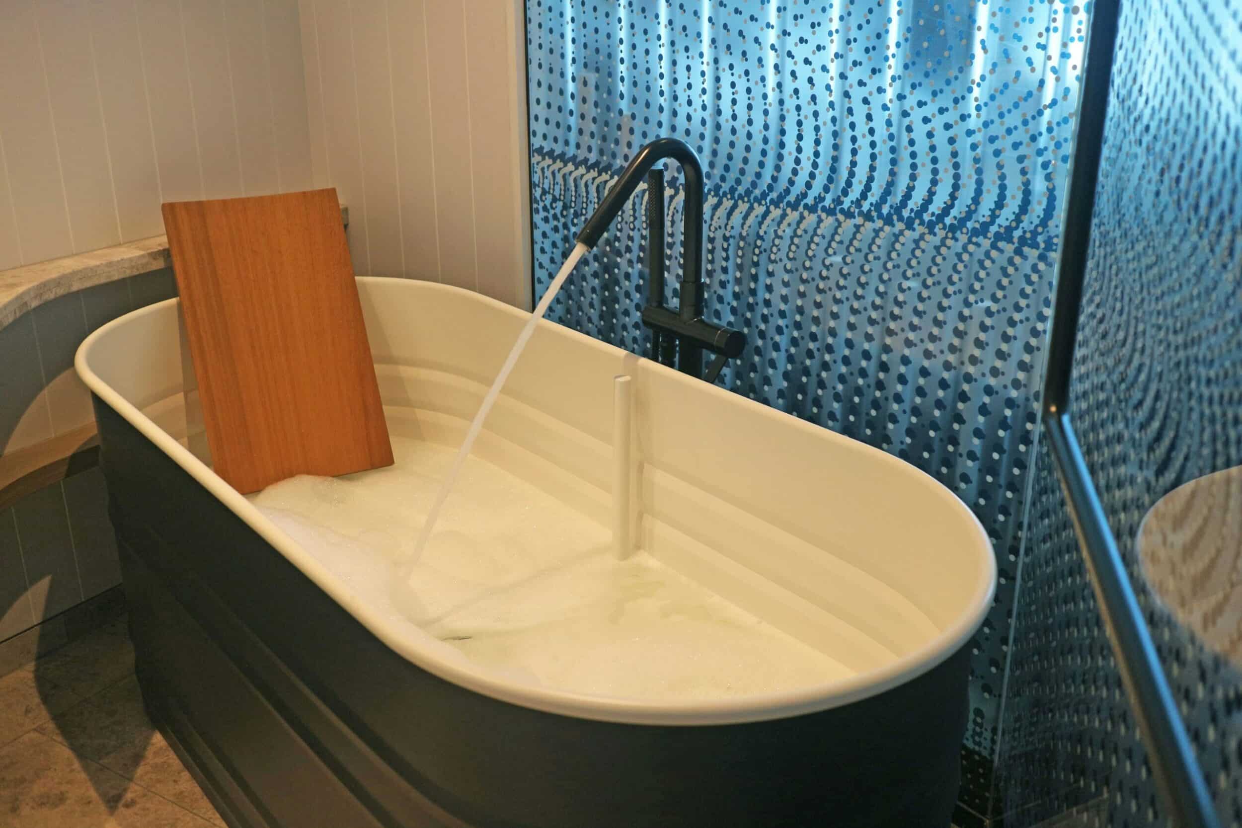 Tub Remodels in Corpus Christi, TX – Safe, Luxurious, and Fast 4 a bathtub with foam and water running out of it